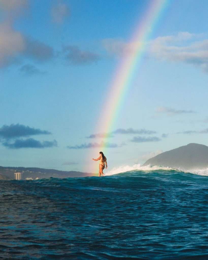 rainbow girl surfing