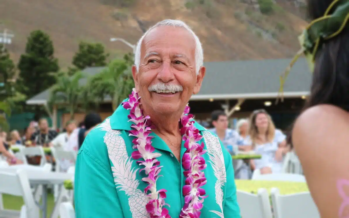 are hawaiian luaus worth it - visitor at a luau wearing a lei