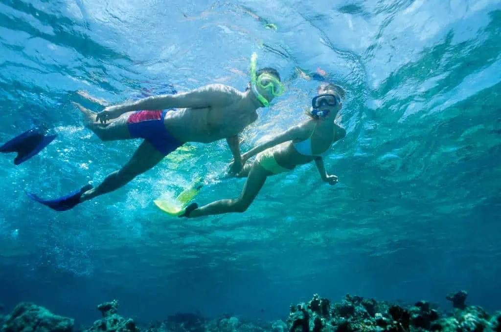 a couple snorkeling at the ko olina lagoons